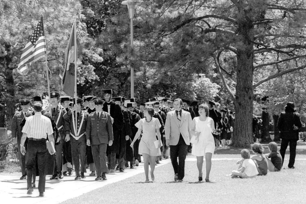Graduating students walk to their Commencement ceremony in 1974. (Mansfield Library, University of Montana)
