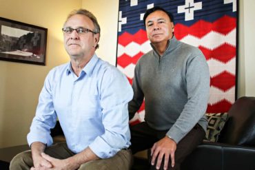 Dermot O’Halloran, left, Senior VP of Corporate Development, and Thomas Acevedo, CEO of S & K Technologies, Inc., pose at the company’s headquarters in Polson, Montana. (AP Photo/Flathead Beacon, Greg Lindstrom)