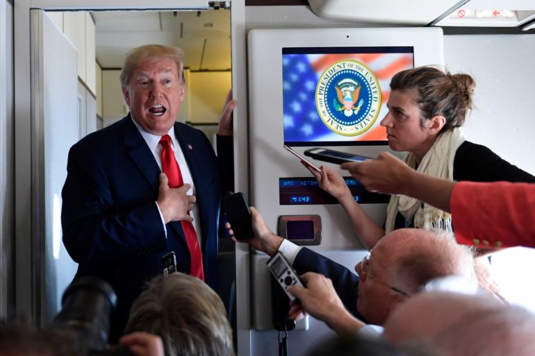 President Donald Trump talks to reporters while in flight from Billings, Montana, to Fargo, N.D. (AP Photo, Susan Walsh)