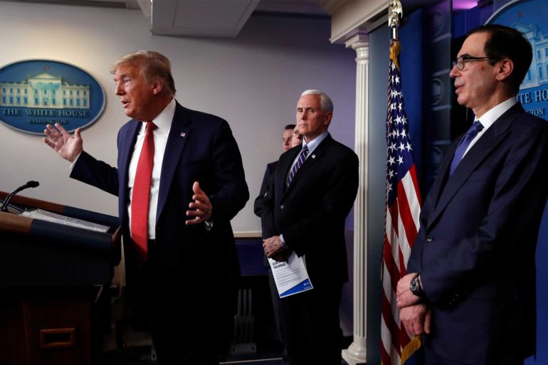 President Donald Trump speaks about the coronavirus as Vice President Mike Pence and Treasury Secretary Steven Mnuchin listen. (AP Photo, Alex Brandon)