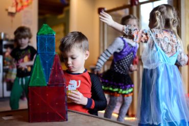 Jameson Webb, 5, creates a rocket during play time at Rhiannon Shook’s early childhood care program in Bozeman. (AP Photo, Rachel Leathe)