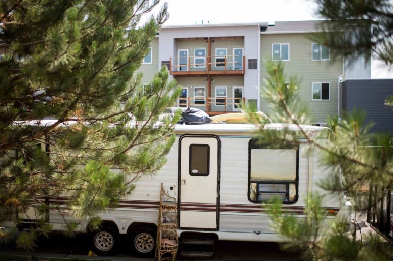 A RV is parked on Sacco Drive next to an affordable housing development under construction in Bozeman. (Rachel Leathe, Bozeman Daily Chronicle)