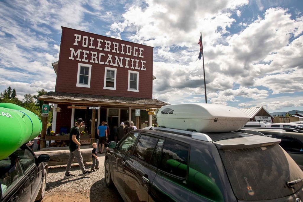 Tourists visit the Polebridge Mercantile on the western boundary of Glacier National Park in Polebridge, Montana. (Ben Allan Smith, Missoulian)